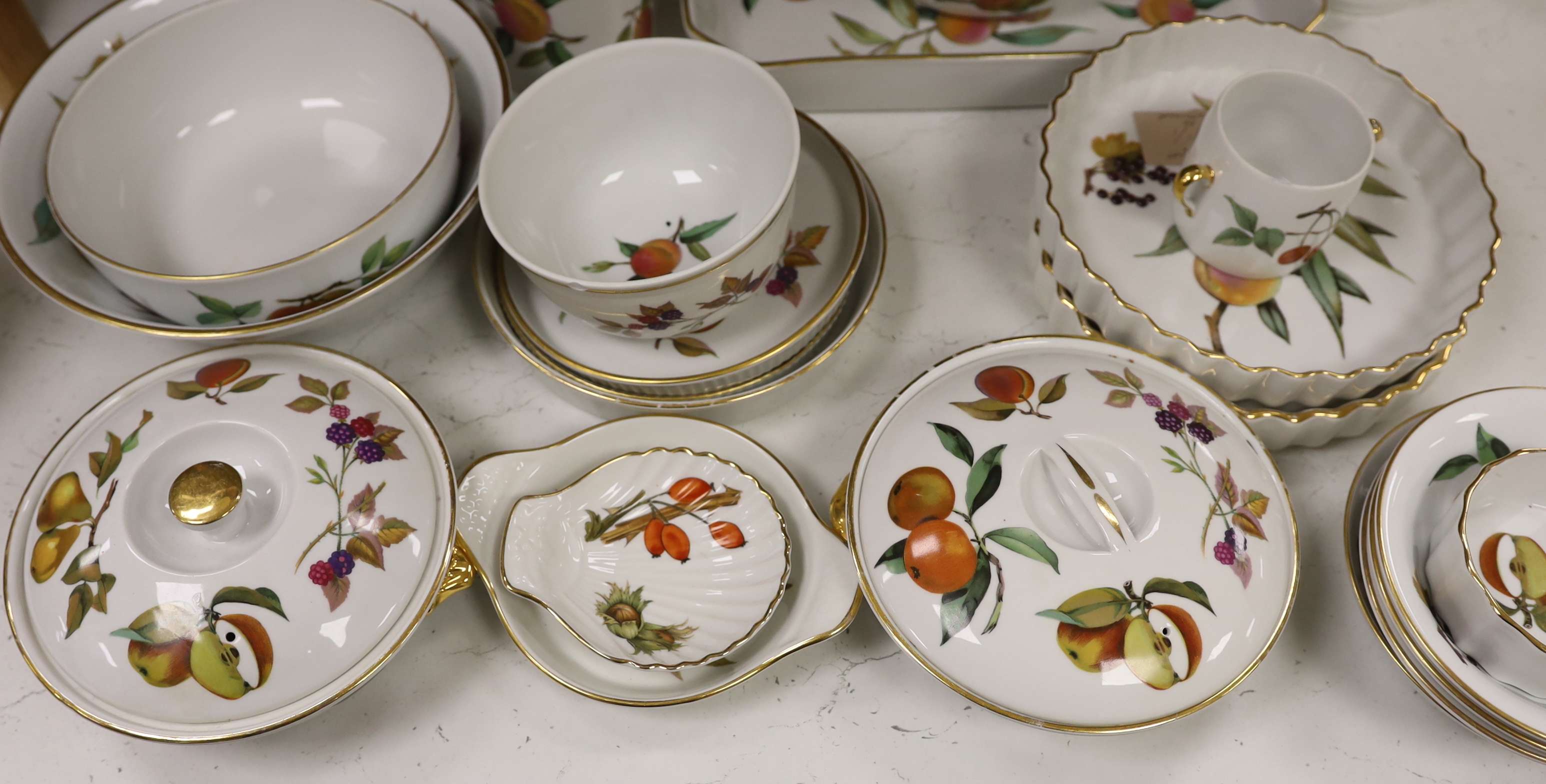 A large quantity of Worcester Evesham dinnerware, including; plates, bowls, serving dishes, jugs, flan, dishes, etc. (70 pieces)